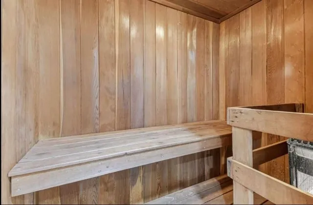 a view of a chair and table on the wooden deck