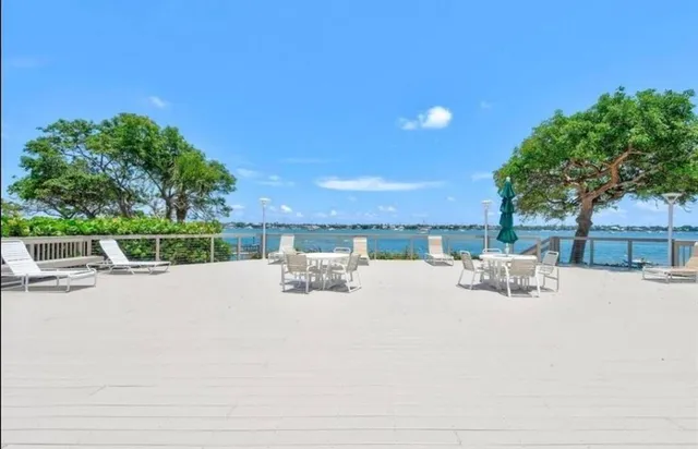 a room with pool table and windows