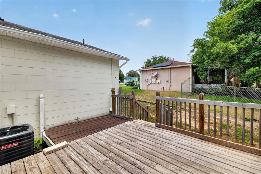 36 Bay Ridge Loop Mascotte, FL 34753 - Photo 27 of 32 a view of a deck with wooden floor and fence