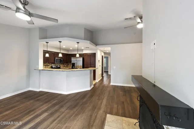 a view of kitchen with wooden floor