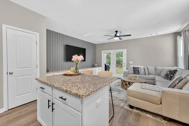a living room with granite countertop furniture and a fireplace