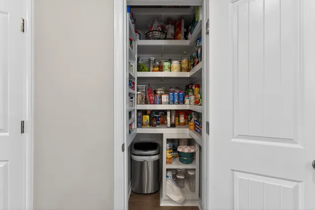 a room with a book shelf and a shelf