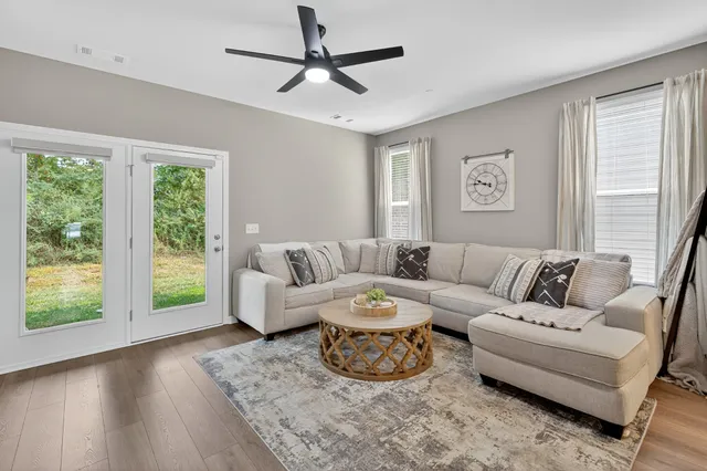 a living room with furniture and a window