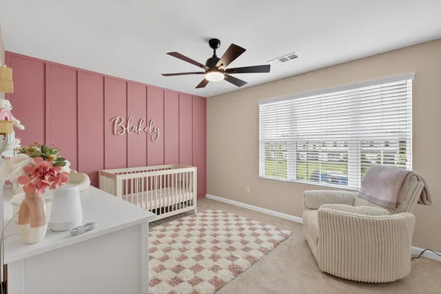 a bedroom with furniture and a window