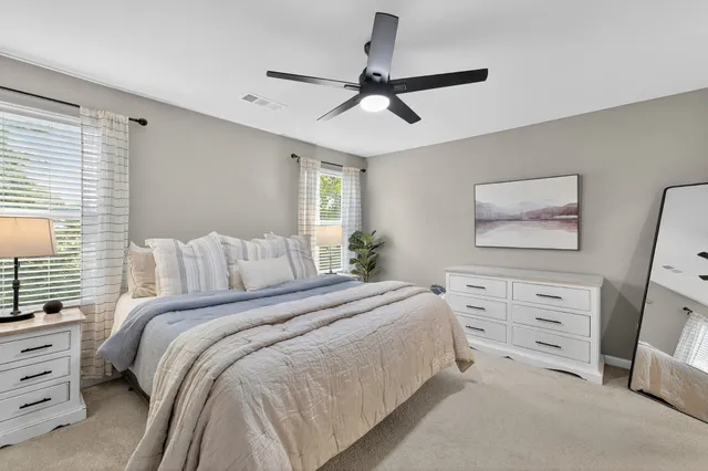 a bedroom with a bed and a dresser