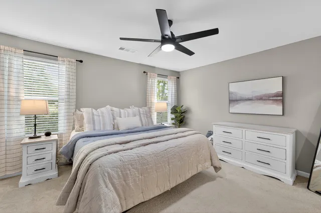 a bedroom with a bed and a dresser