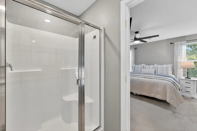 a bathroom with a bathtub and a shower