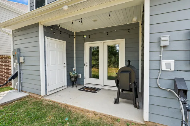 an aerial view of a house with a yard and potted plants