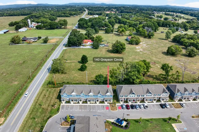 an aerial view of a house with a garden