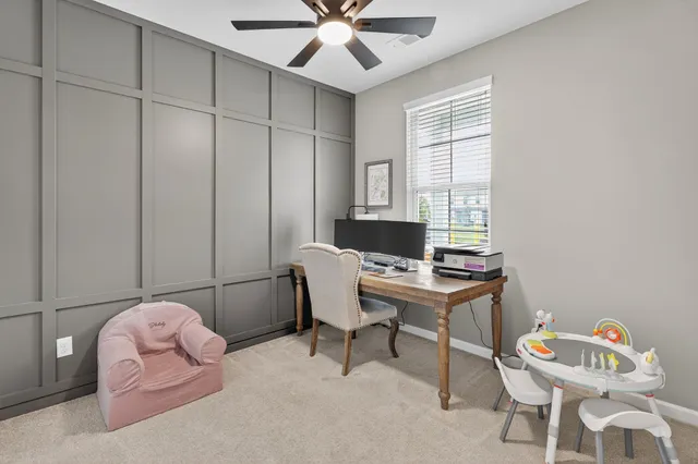 a workspace with furniture and window