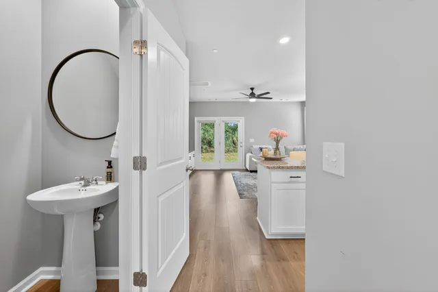 a bathroom with a sink toilet and a mirror