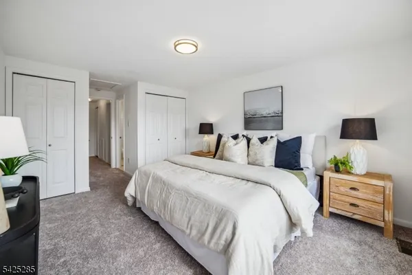 a bedroom with bed and a window