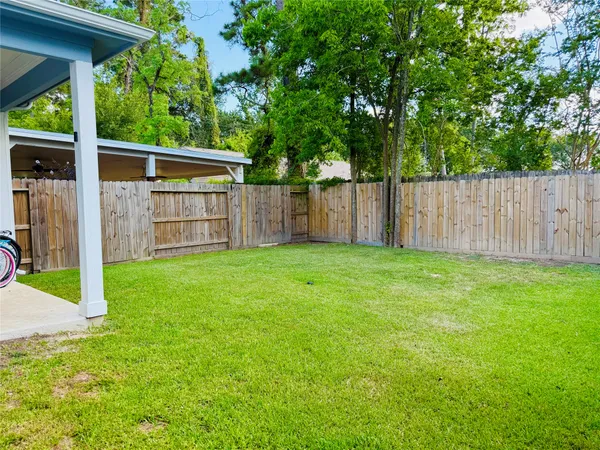 a front view of house with yard and outdoor seating