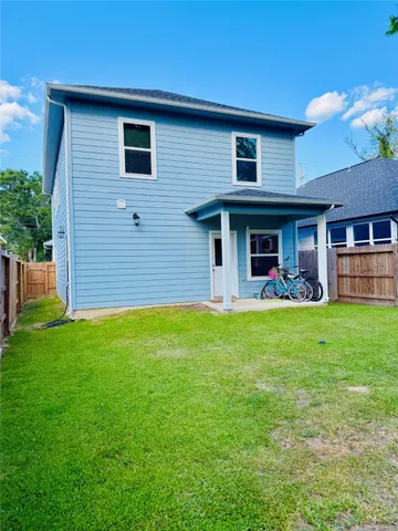 a front view of house with yard and outdoor seating