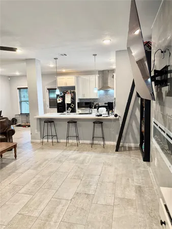 a kitchen with a sink and a stove top oven