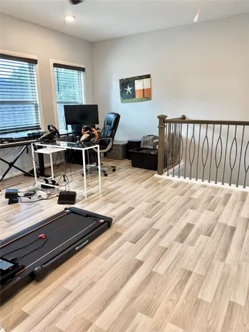 a view of a workspace with furniture