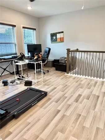 a bedroom with a bed and a ceiling fan