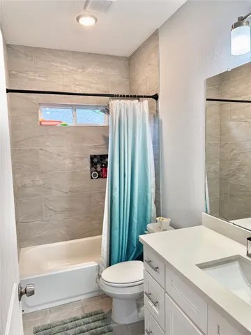 a bathroom with a sink a toilet and a bathtub