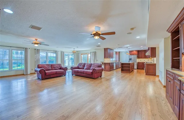 a kitchen with stainless steel appliances granite countertop wooden cabinets a sink and dishwasher