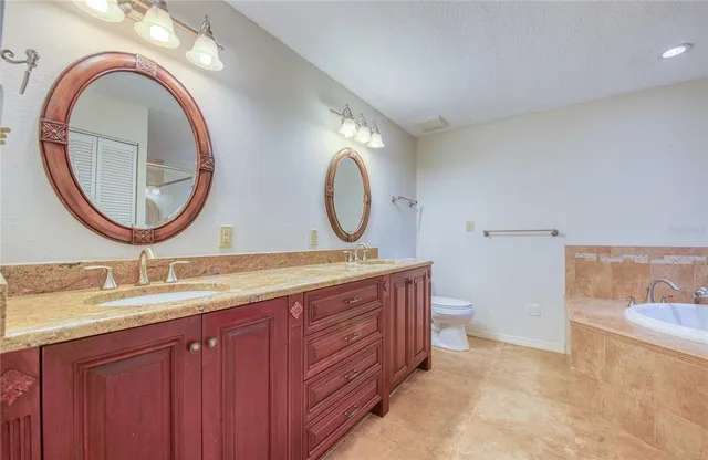an empty room with a window and a ceiling fan