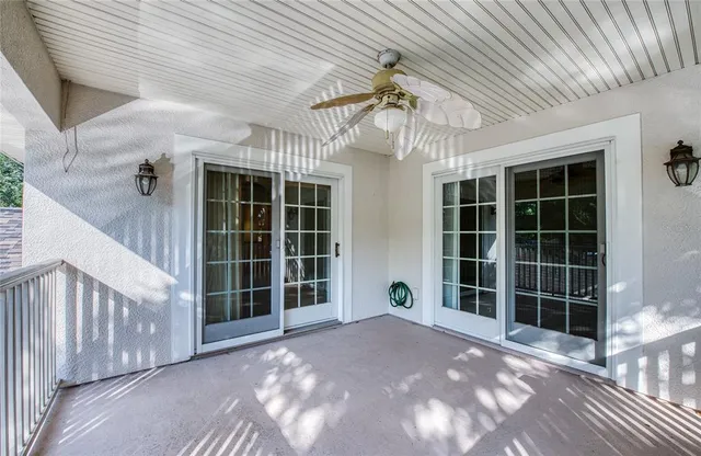 a front view of a house with a yard and fountain