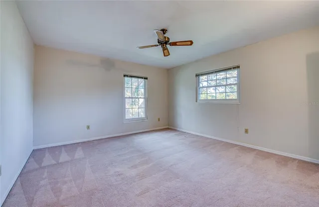 an aerial view of residential houses with yard
