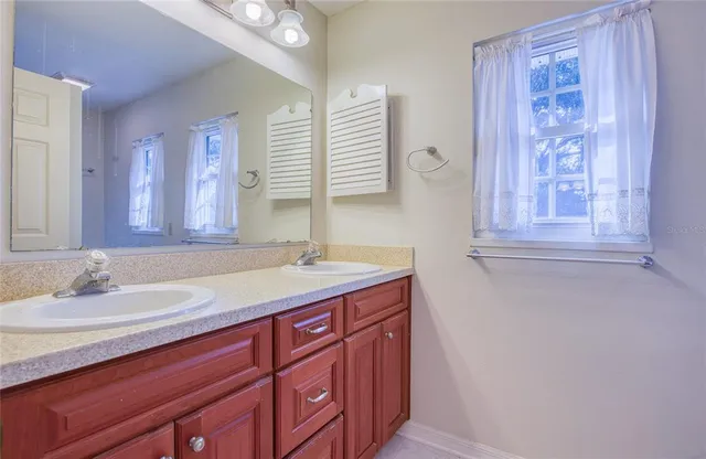 an aerial view of a house with a swimming pool