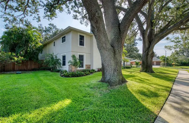 a living room with furniture window and wooden floor