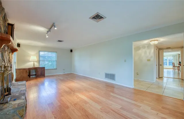 a living room with furniture window and wooden floor