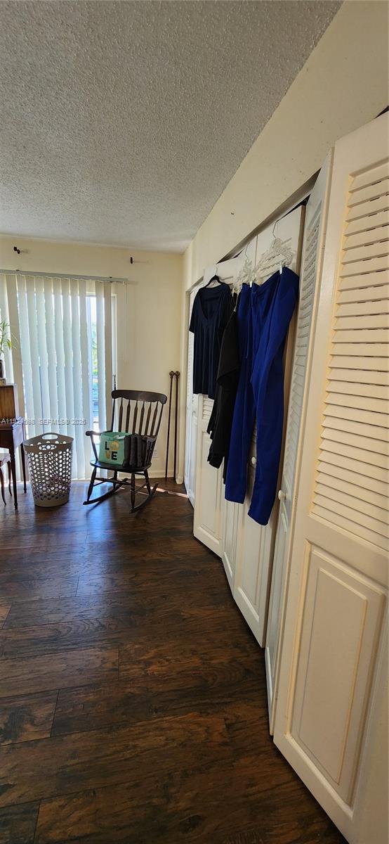 191 Preston Way, Unit 191 Boca Raton, FL 33434 - Photo 11 of 13 a view of a hallway with wooden floor and furniture