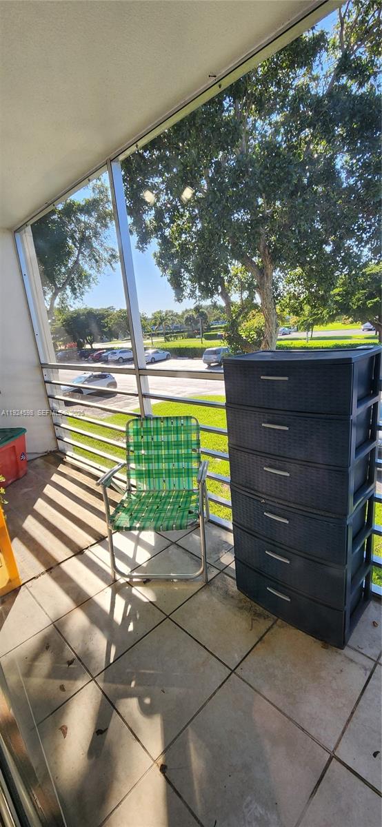 191 Preston Way, Unit 191 Boca Raton, FL 33434 - Photo 13 of 13 a view of a room with wooden walls and potted plants