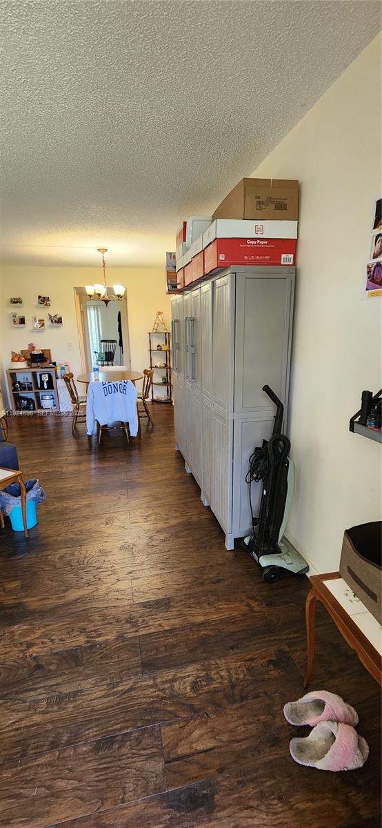 191 Preston Way, Unit 191 Boca Raton, FL 33434 - Photo 4 of 13 a bedroom with furniture and a wooden floor