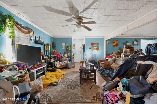 a room with lots of furniture and a flat screen tv