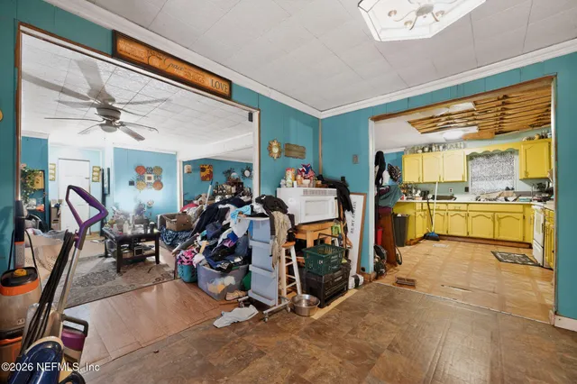 a kitchen with sink a stove and cabinets