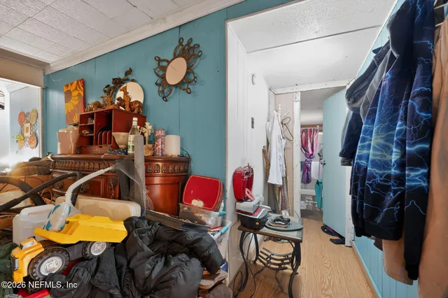 a very nice looking room with a large window and couch