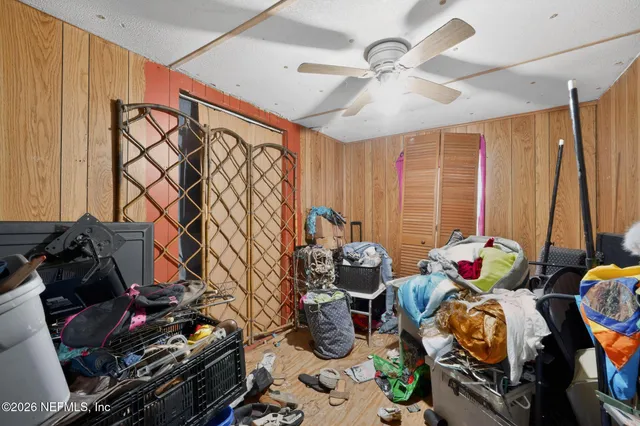 a living room with lots of furniture and a chandelier