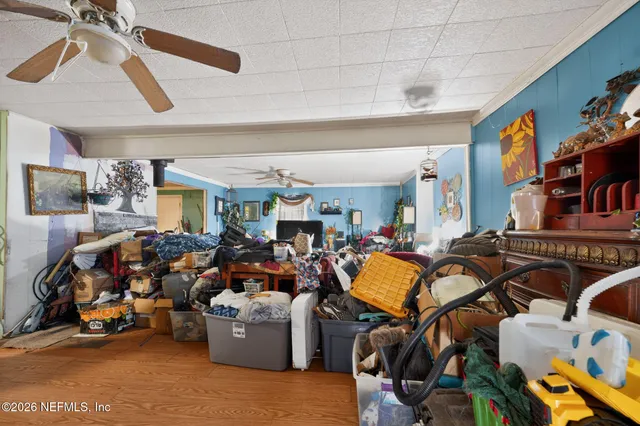 a bedroom with furniture and a window