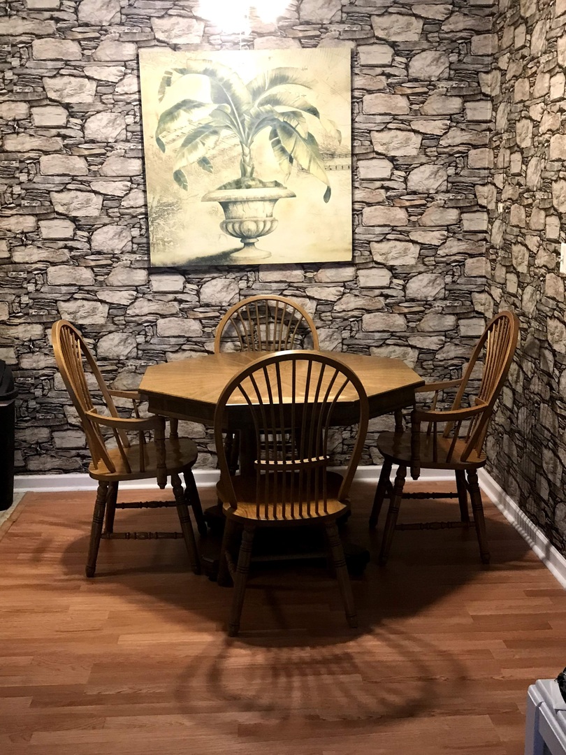 1900 Light Road, Unit 110 Oswego, IL 60543 - Photo 4 of 15 a view of a dinning tables and chairs in the patio