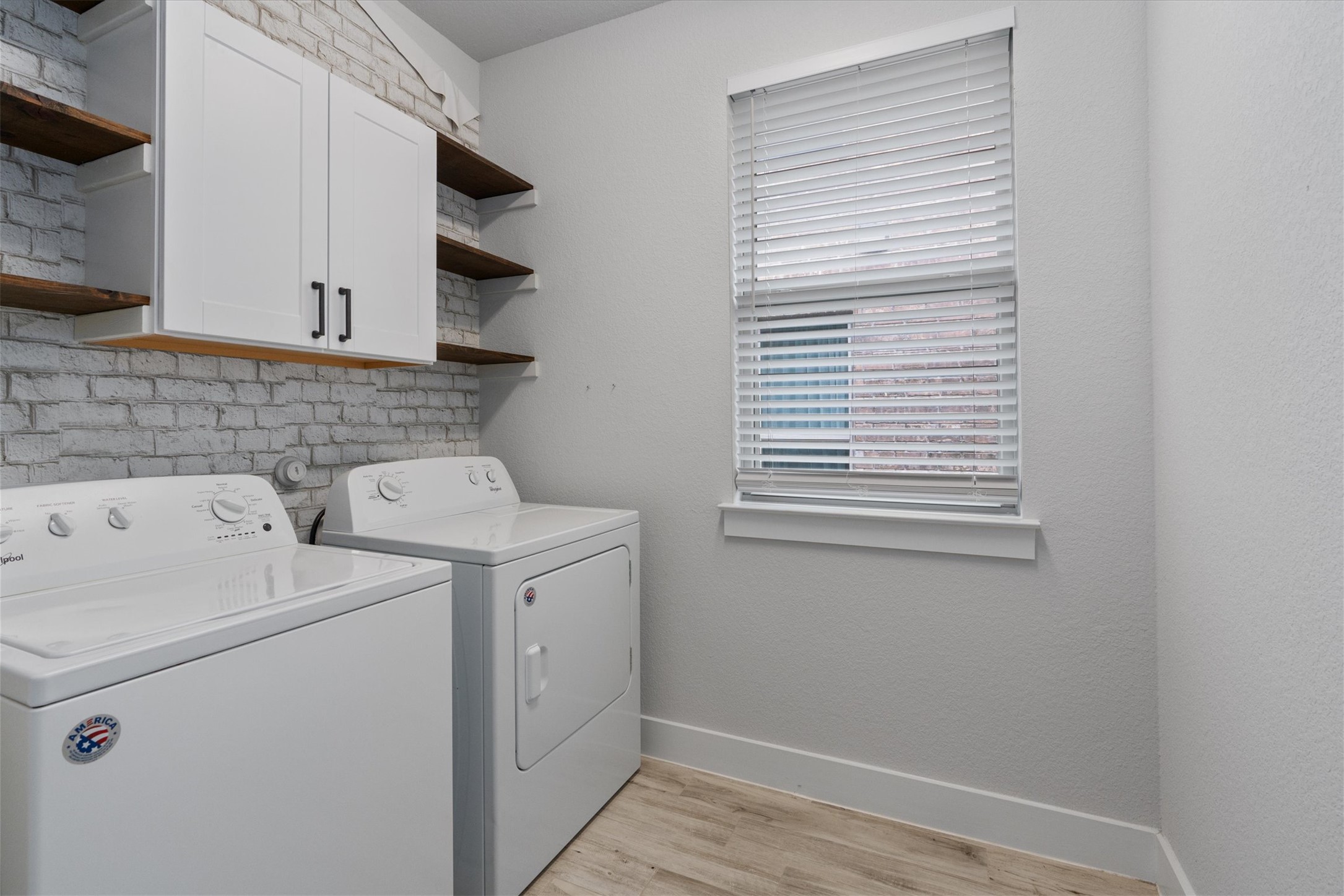 941 Del Raphael Drive Leander, TX 78641 - Photo 20 of 31 Spacious laundry with built-in shelving and cabinetry
