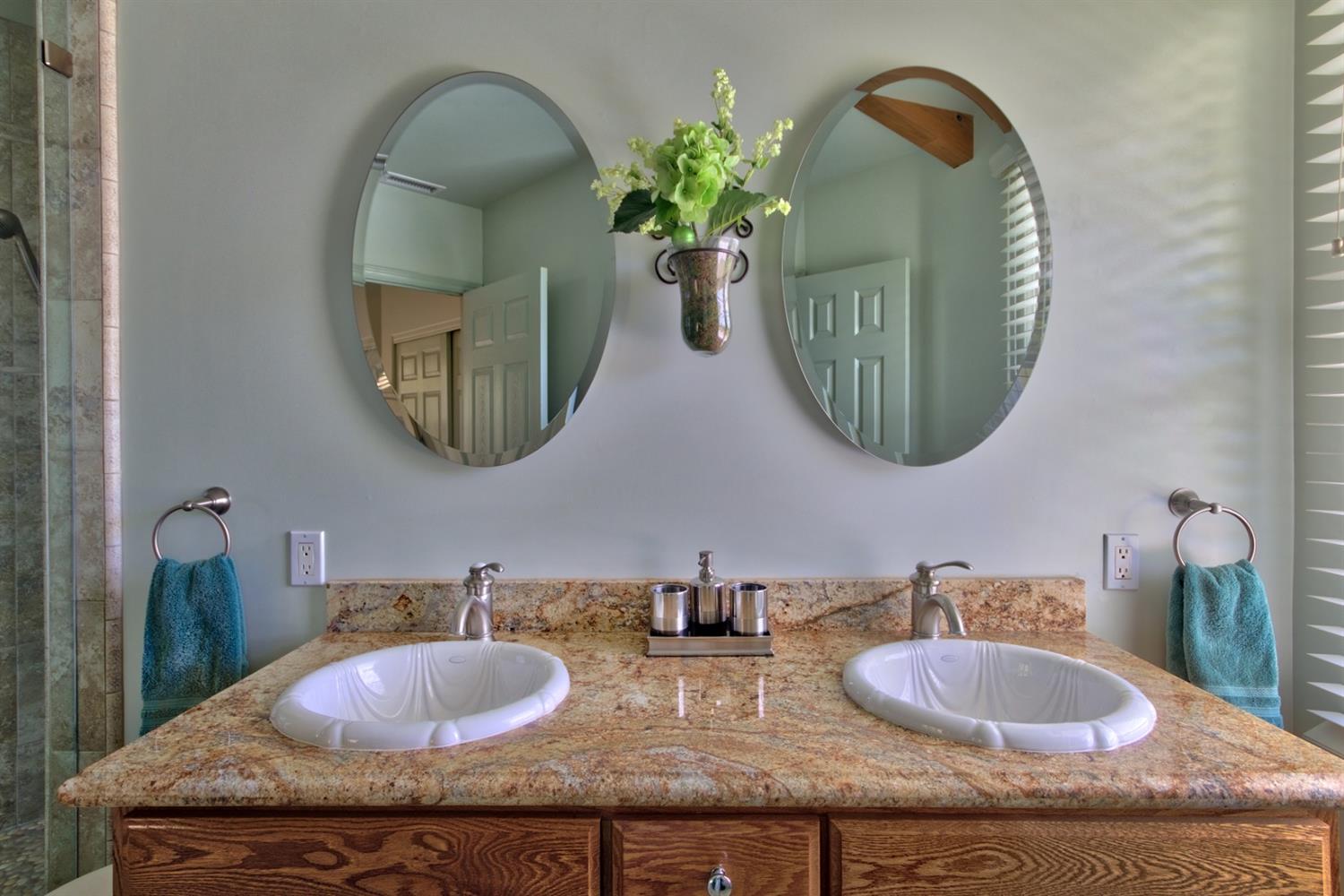 304 Fairview Road Ojai, CA 93023 - Photo 12 of 32 a bathroom with double vanity sinks and a mirror