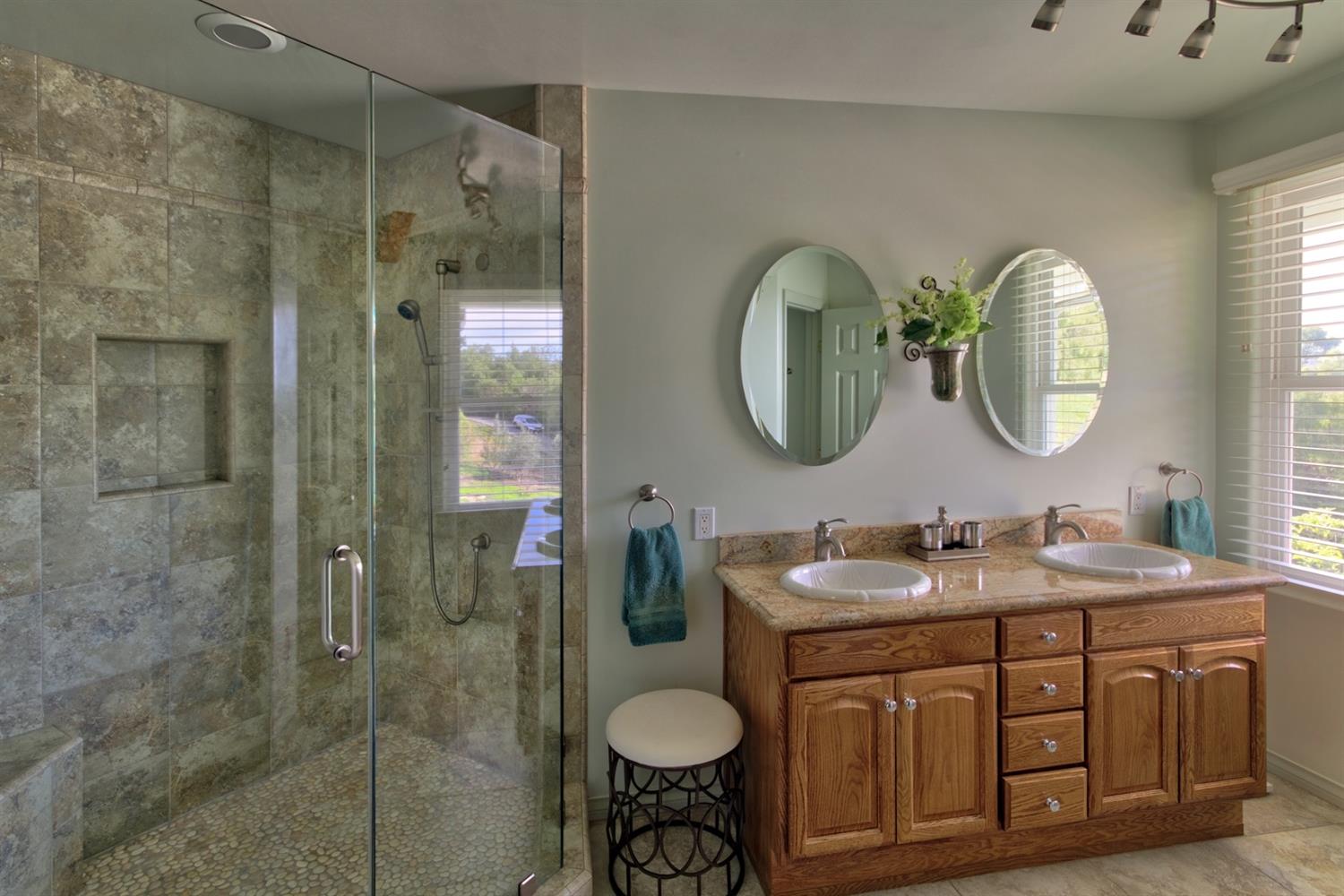 304 Fairview Road Ojai, CA 93023 - Photo 14 of 32 a bathroom with a double vanity sink and a mirror