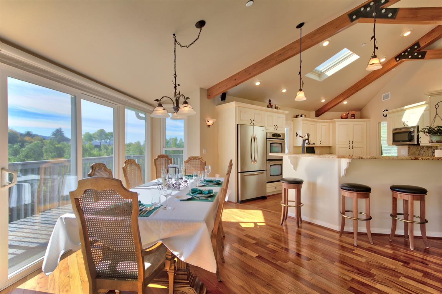 304 Fairview Road Ojai, CA 93023 - Photo 16 of 32 a view of a dining room with furniture large windows and wooden floor
