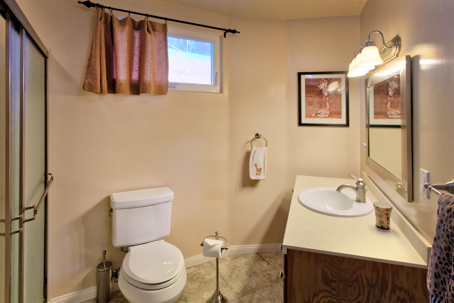 304 Fairview Road Ojai, CA 93023 - Photo 31 of 32 a bathroom with a sink vanity mirror and toilet