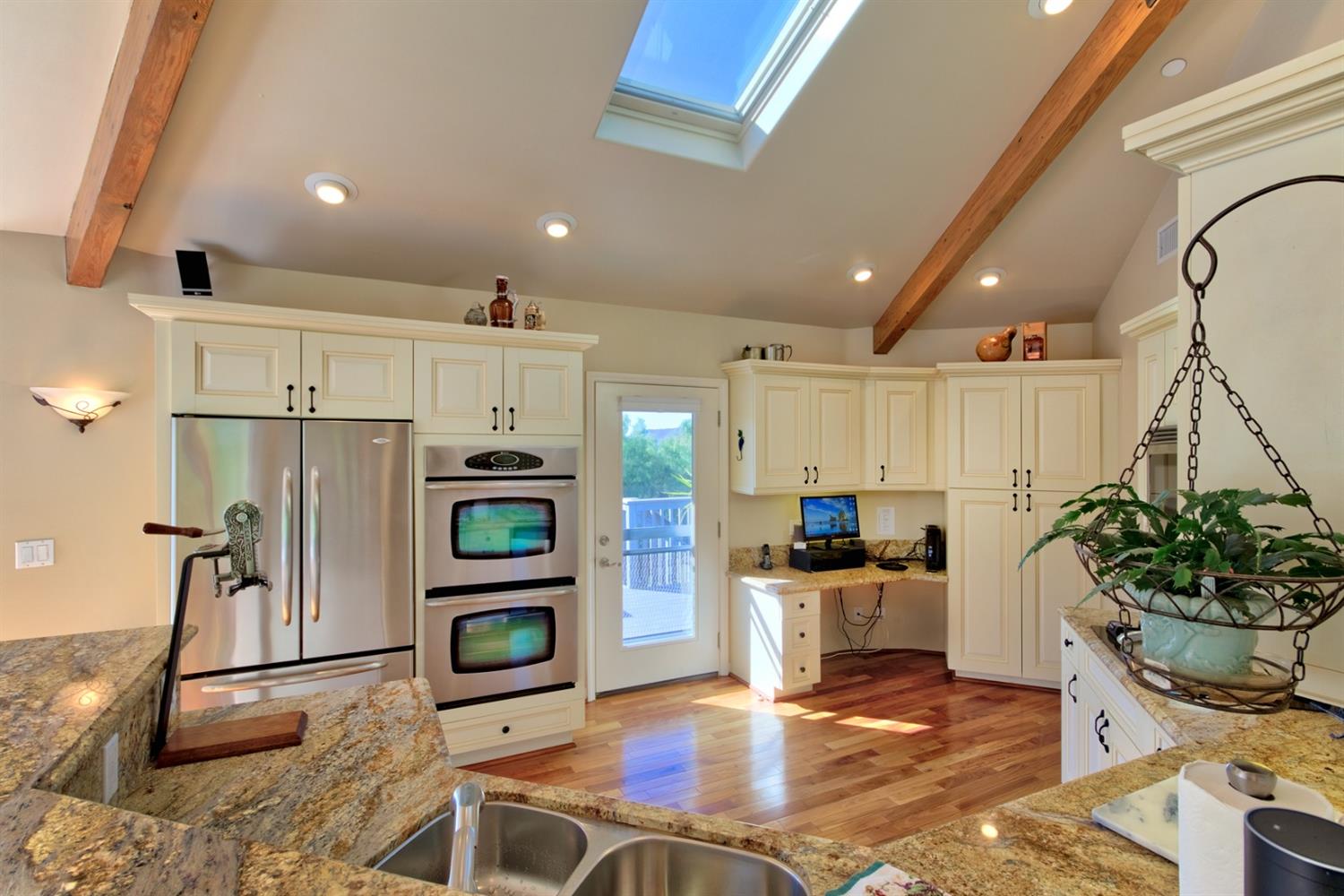 304 Fairview Road Ojai, CA 93023 - Photo 10 of 32 a kitchen with stainless steel appliances kitchen island granite countertop a refrigerator and a sink
