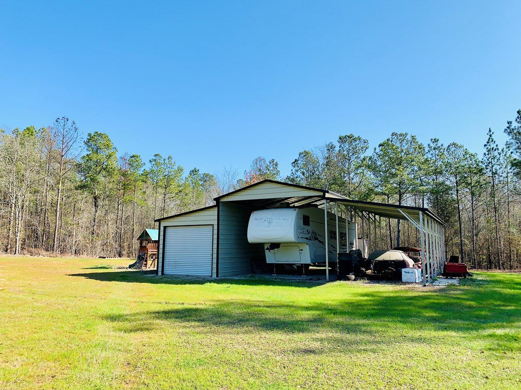 164 Hamelin Road Aiken, SC 29805 - Photo 17 of 38 a house view with swimming pool in front of it