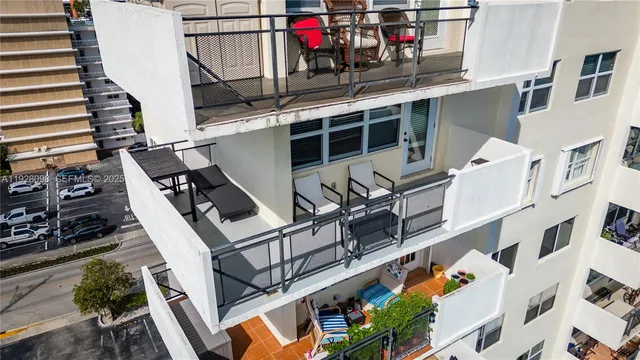 a view of a kitchen with furniture and a kitchen