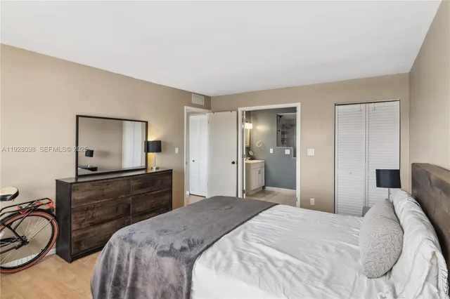 a bed room with a bed and a lamp