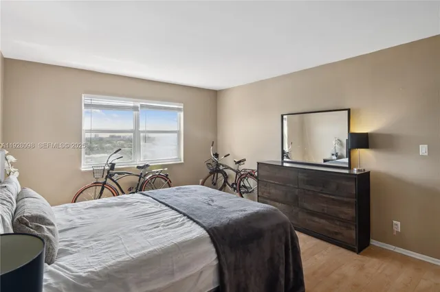 a kitchen with stainless steel appliances granite countertop a refrigerator a microwave a sink and cabinets