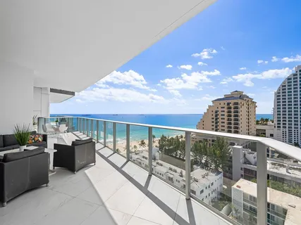 a balcony with view of an outdoor seating
