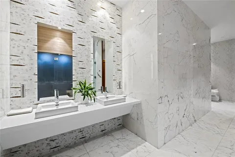 a view of a hallway with paintings on the wall